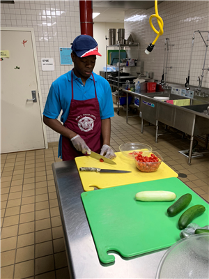 commercial food student chopping vegetables 