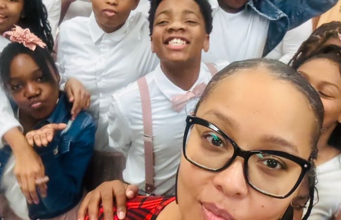  Vocal music teacher taking a selfie with her students