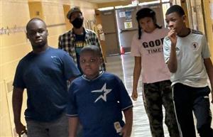 Man with group of students