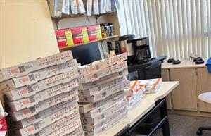  boxes of pizzas on a table