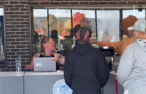 3 people being serviced at SOS mobile unit