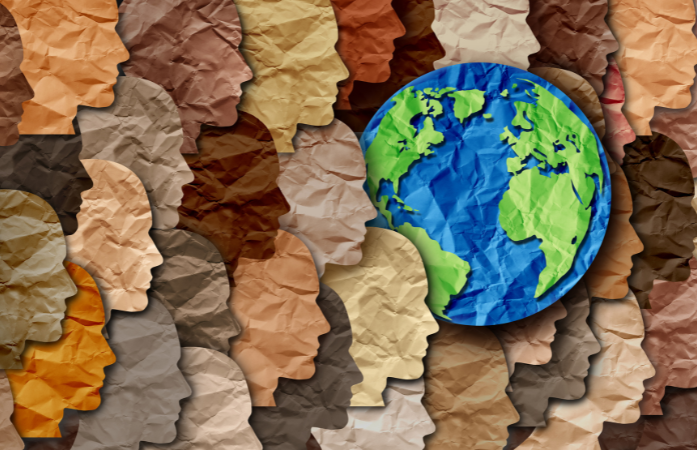  different shades of brown paper faces with the world in the backaground