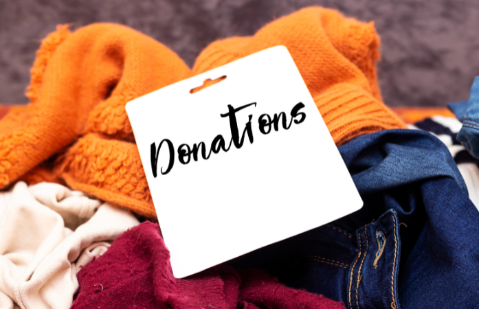  donations, blue jeans, yellow-orange shirt, burgundy scarf
