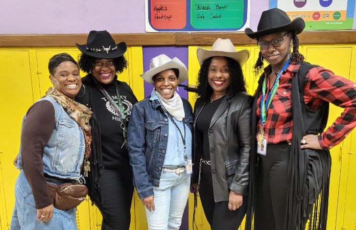  Staff in cowboy out fits