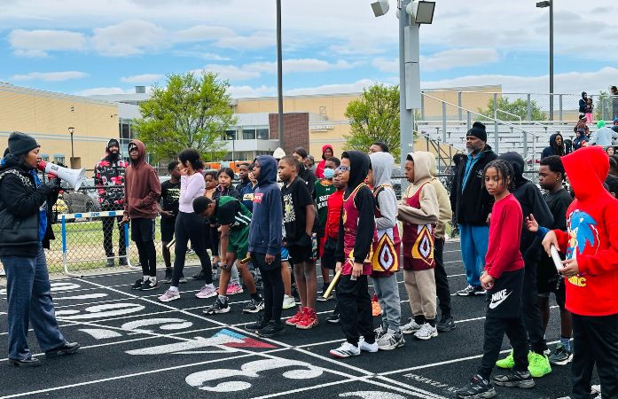  Coach and students on the track