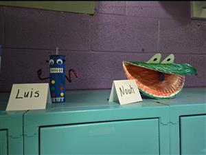 Handmade toys sitting on a locker