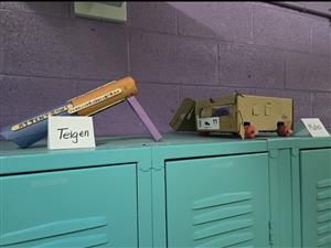 Handmade toys sitting on a locker