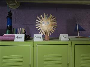 Handmade toys sitting on a locker