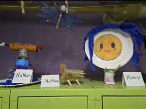 Handmade toys sitting on a locker