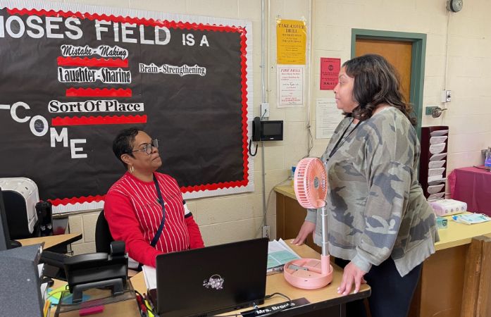  Two adults exchanging information
