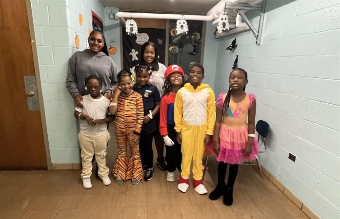  Elementary class in the hallway wearing their Halloween