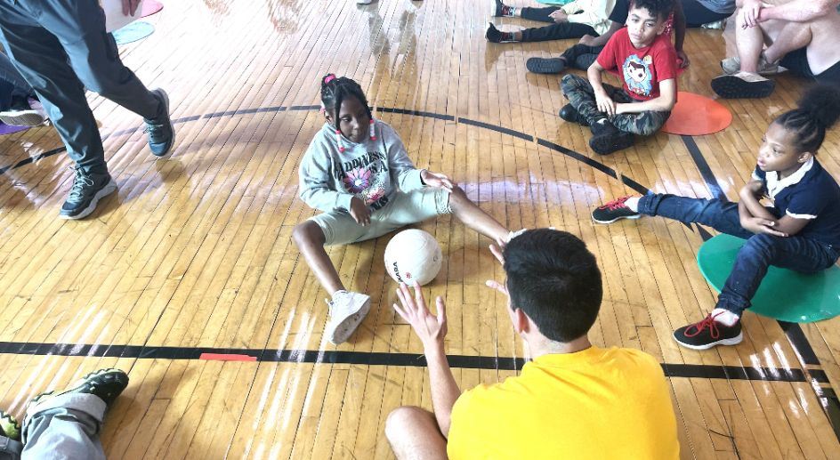  Wayne State University P.E. Students playing catch ball with Moses Field student 