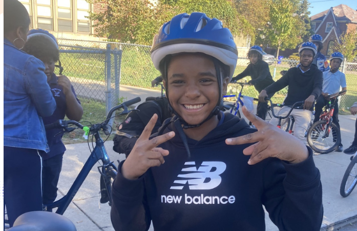  student smiling with helmet on