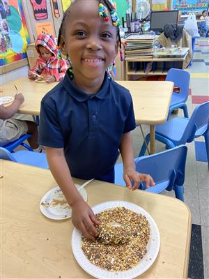 students making birdfeeders