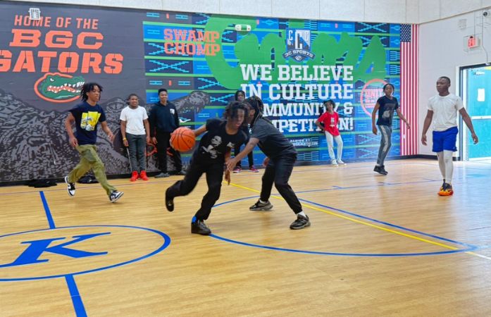  students playing basketball