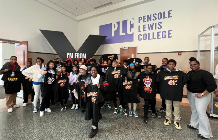  middle school students posed together in front of Pensole Lewis College text