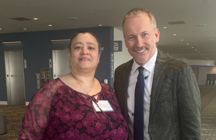  teacher smiling with Ron Clark