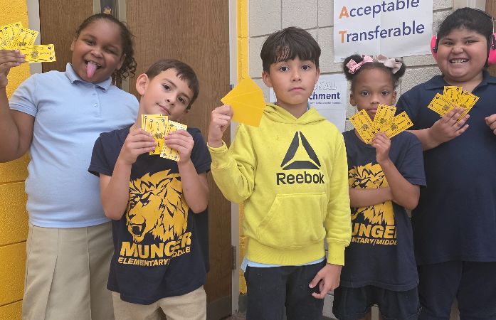  Image of students with their yellow PBIS bucks