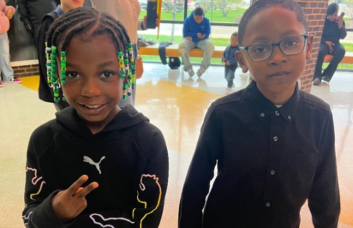  A boy and girl posing for picture