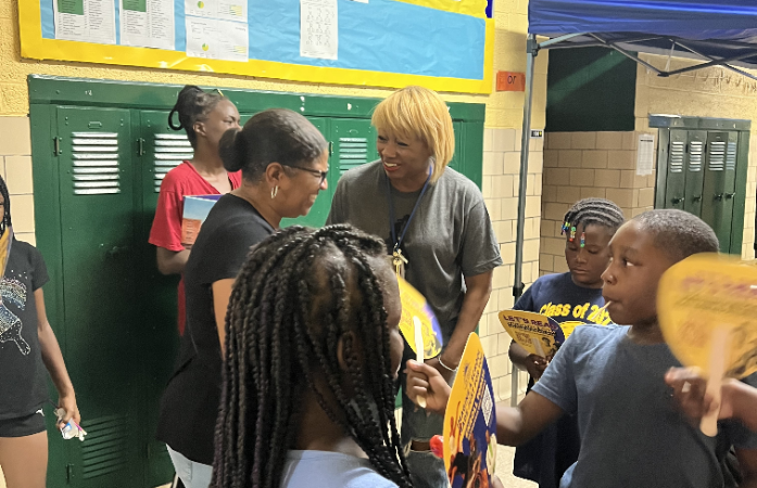  Principal Adams welcomes stakeholders back with smiles