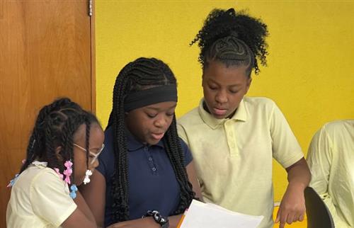Group of girls presenting school-wide information