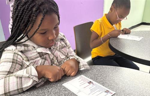  Two elementary girls vote for the 2024 Presidential Candidate