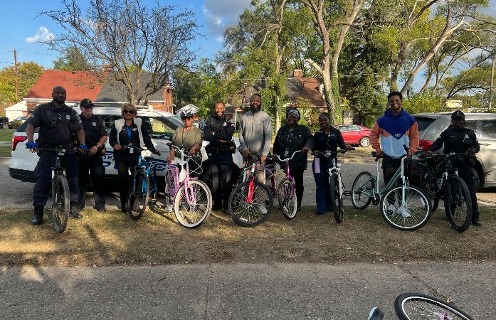 Staff and DPD pose for picture with bikes