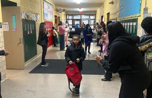 Staff clapping for students