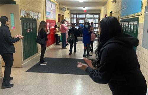 Staff clapping for students