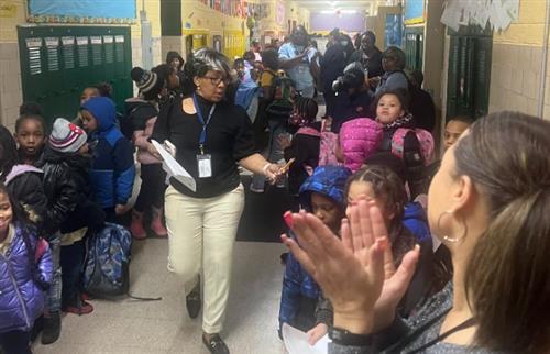 Staff clapping for students