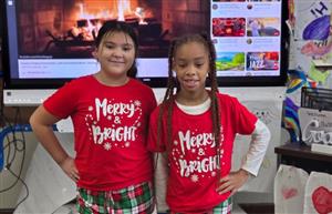 two students in holiday pajamas