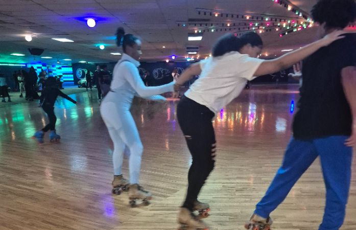 three students skating