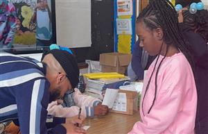  Jamar Marreign signing cards for students