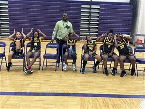 girls basketball team with coach