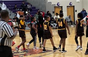 girls basketball team lined up on the court
