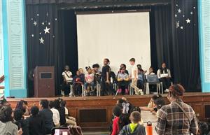 students on stage 