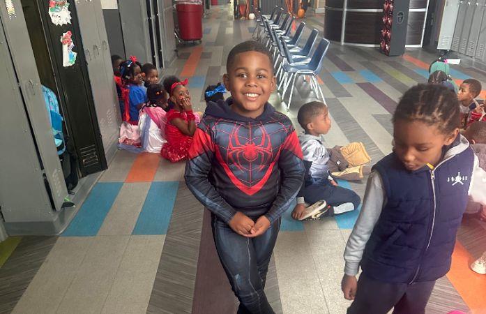  student standing with costume 