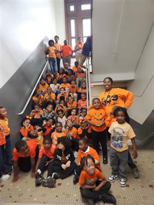 students and staff on stairs