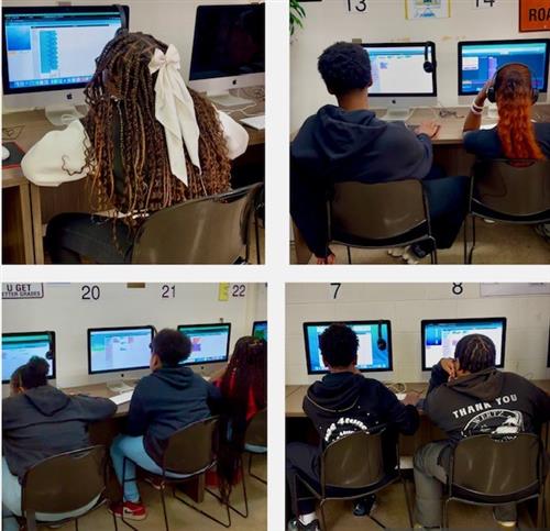 students sit at a computer