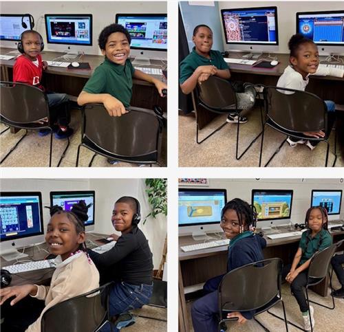 students sit at a computer