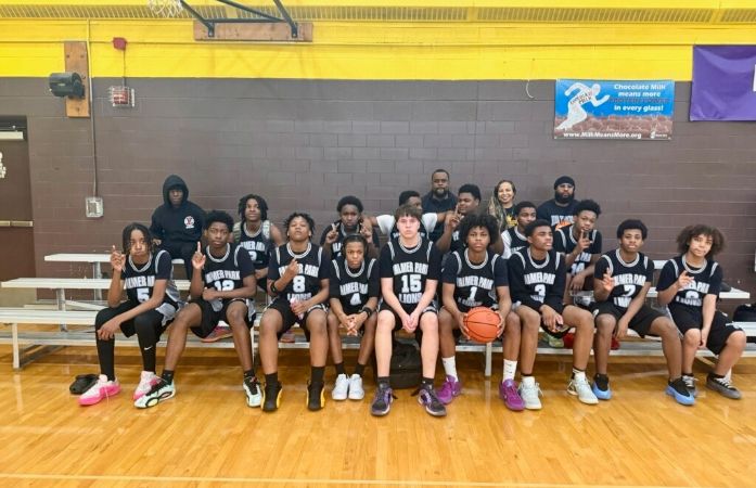  boys basketball team posing for photo