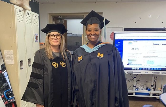 Dr. Kuzniar and Mrs. Cole in graduation owns