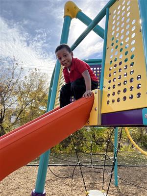 CHILD ON SLIDE