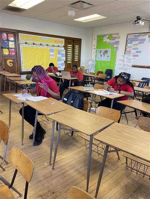 Scholars in classroom.