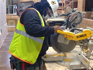 Student cutting Lumber