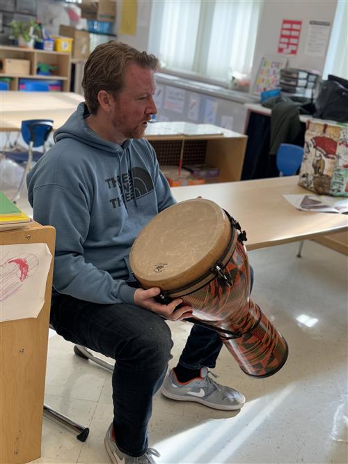 man playing instrument