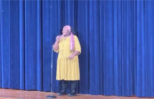  8th grade young lady performing her vocal solo on stage