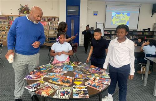  Principal Cannon with 3 students picking out comic books