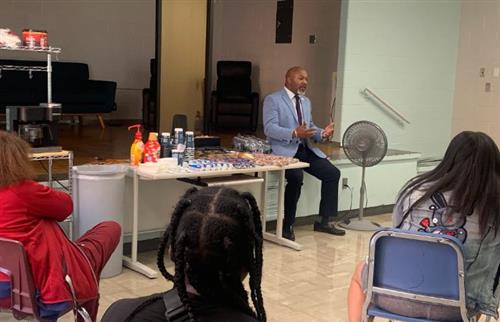  Principal Cannon speaking with parents during his monthly parent meeting
