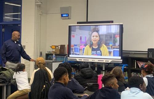  Principal Cannon presenting the Spain Promo video to Chrysler parents and students via smartboard